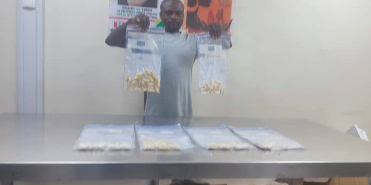 Choked by ingested drugs, India-bound passenger vomits, excretes 80 wraps of cocaine